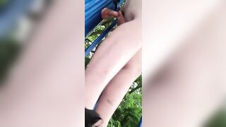 Slut having fun with dildo in public park